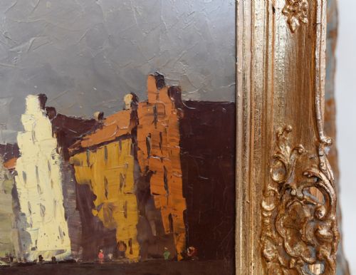 fig 2. An expressionist oil painting depicting a canal with buildings and a stone bridge, enclosed within an ornate gilded frame.