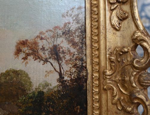 fig 2. A Victorian oil painting depicting a rural Suffolk landscape with fields and trees, housed in an ornate gold gilded frame.