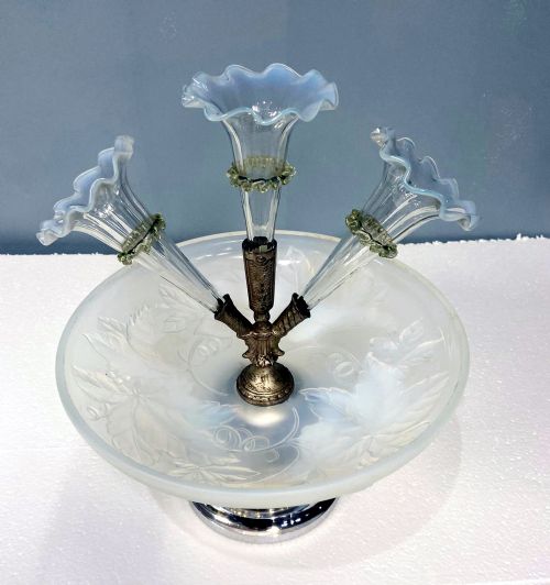 fig 2. An Art Deco opalescent glass epergne centrepiece featuring three trumpet-shaped glass vases mounted above a frosted glass bowl on a chrome base.