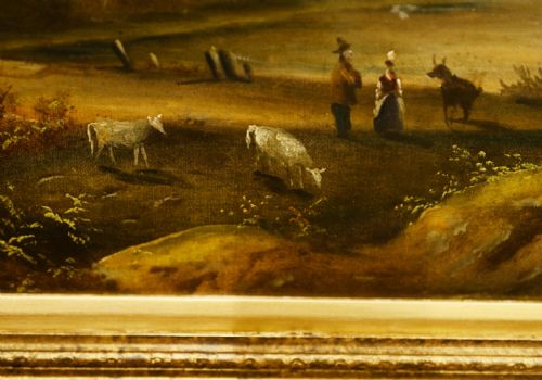 fig 1. An antique oil painting depicting an Italian pastoral landscape with classical ruins and a stone bridge, housed in an ornate carved gold gilt frame.