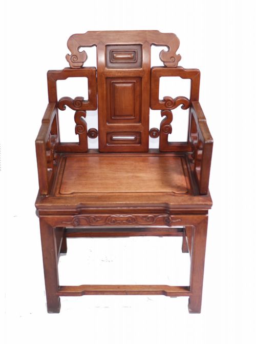 fig 1. A matching pair of dark warm brown Chinese carved hardwood armchairs featuring decorative splats, openwork armrests, and hard wooden seats.