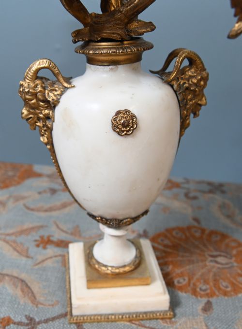 fig 2. A pair of late 19th-century French Louis XVI Revival gilt bronze and white marble three-arm candelabras featuring urn-shaped bases and floral branch detailing.