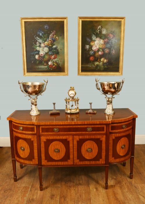 fig 1. An Edwardian Sheraton Revival mahogany sideboard featuring satinwood oval inlay panels, crossbanded edging, brass ring handles, and square tapered legs.