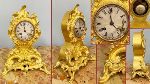 fig 1. A late 19th-century French Rococo gilt metal mantel clock featuring ornate acanthus leaf scrollwork surrounding a circular dial with Roman numerals.