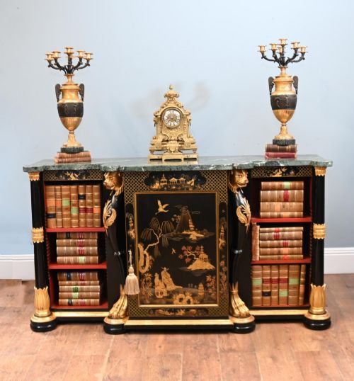 fig 1. A Regency Revival side cabinet featuring a green marble top, a central black lacquer door decorated with gilded Chinoiserie artwork, and flanking open shelves with red interiors.