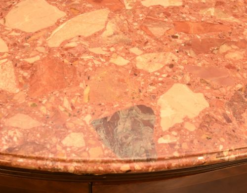 fig 3. A Louis XV Revival walnut side cabinet featuring a serpentine front, floral marquetry inlay, pink marble top, and gilt-bronze mounts on cabriole legs.