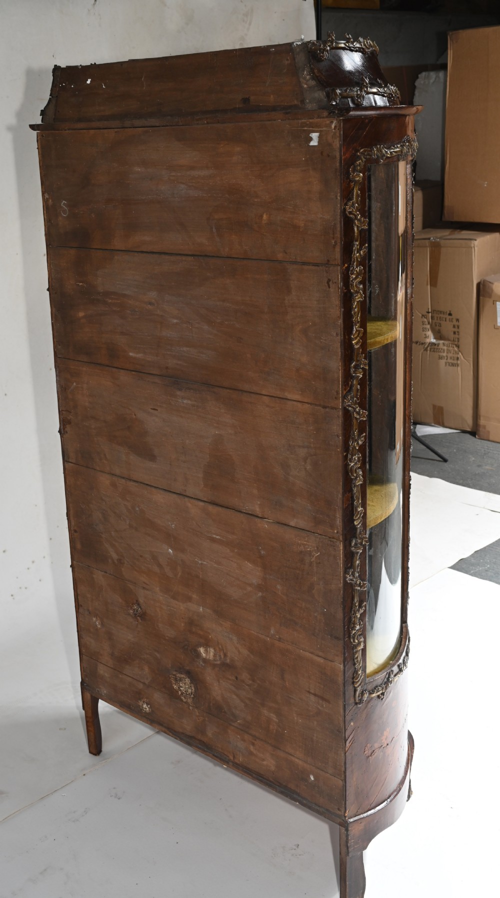 An antique French glazed vitrine cabinet with curved glass panels, floral marquetry inlay on the lower doors, and ornate brass ormolu mounts. View X