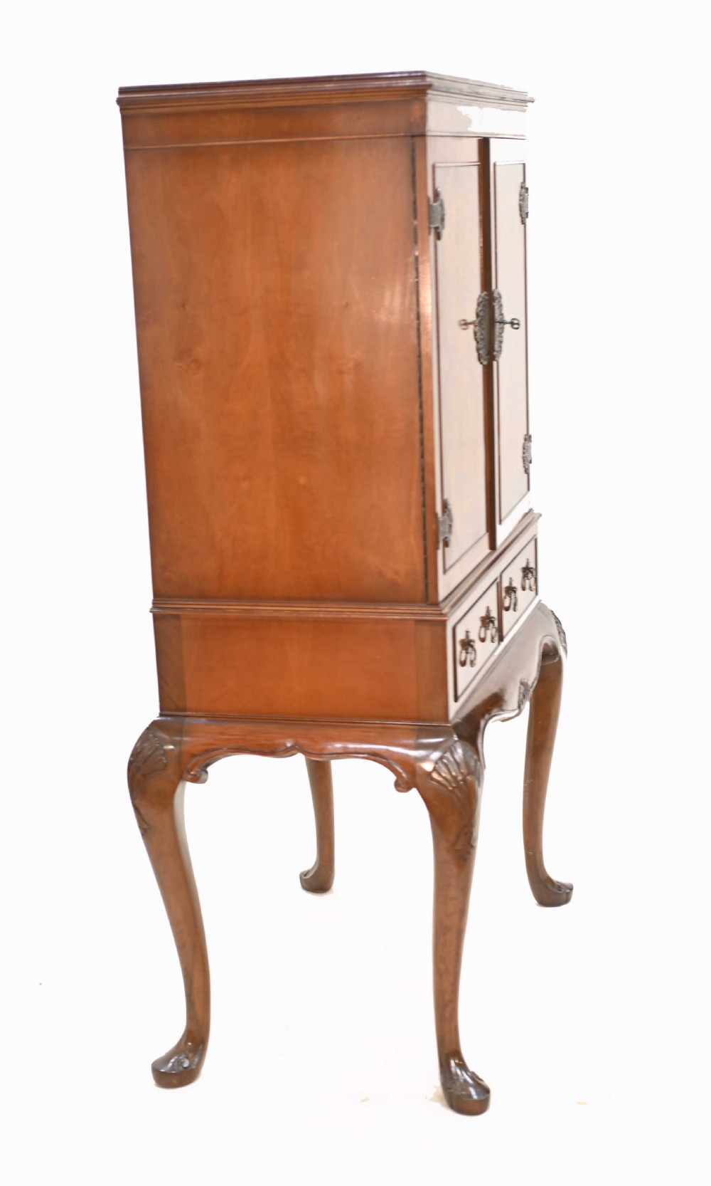 An Art Deco burr walnut drinks cabinet on a carved cabriole leg stand with ornate brass hardware and two lower drawers. View XI