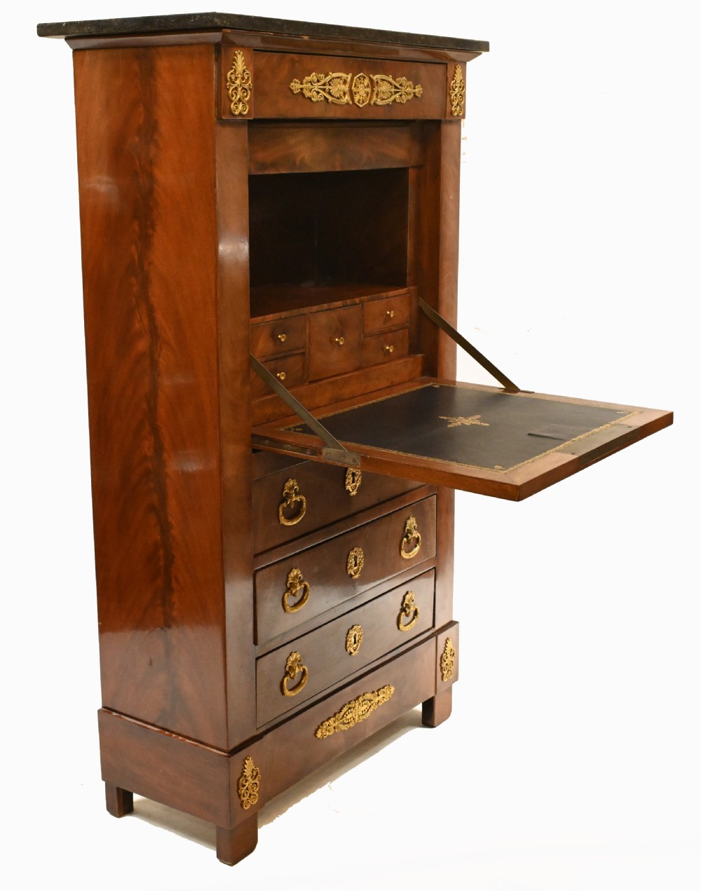 A late 19th-century French Empire mahogany escritoire desk featuring a dark marble top, drop-front writing compartment, three lower drawers, and ornamental gilt-bronze mounts. View X