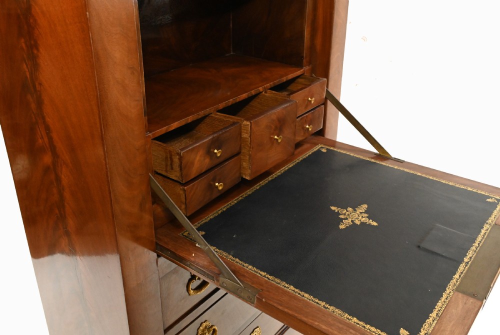 A late 19th-century French Empire mahogany escritoire desk featuring a dark marble top, drop-front writing compartment, three lower drawers, and ornamental gilt-bronze mounts. View XII