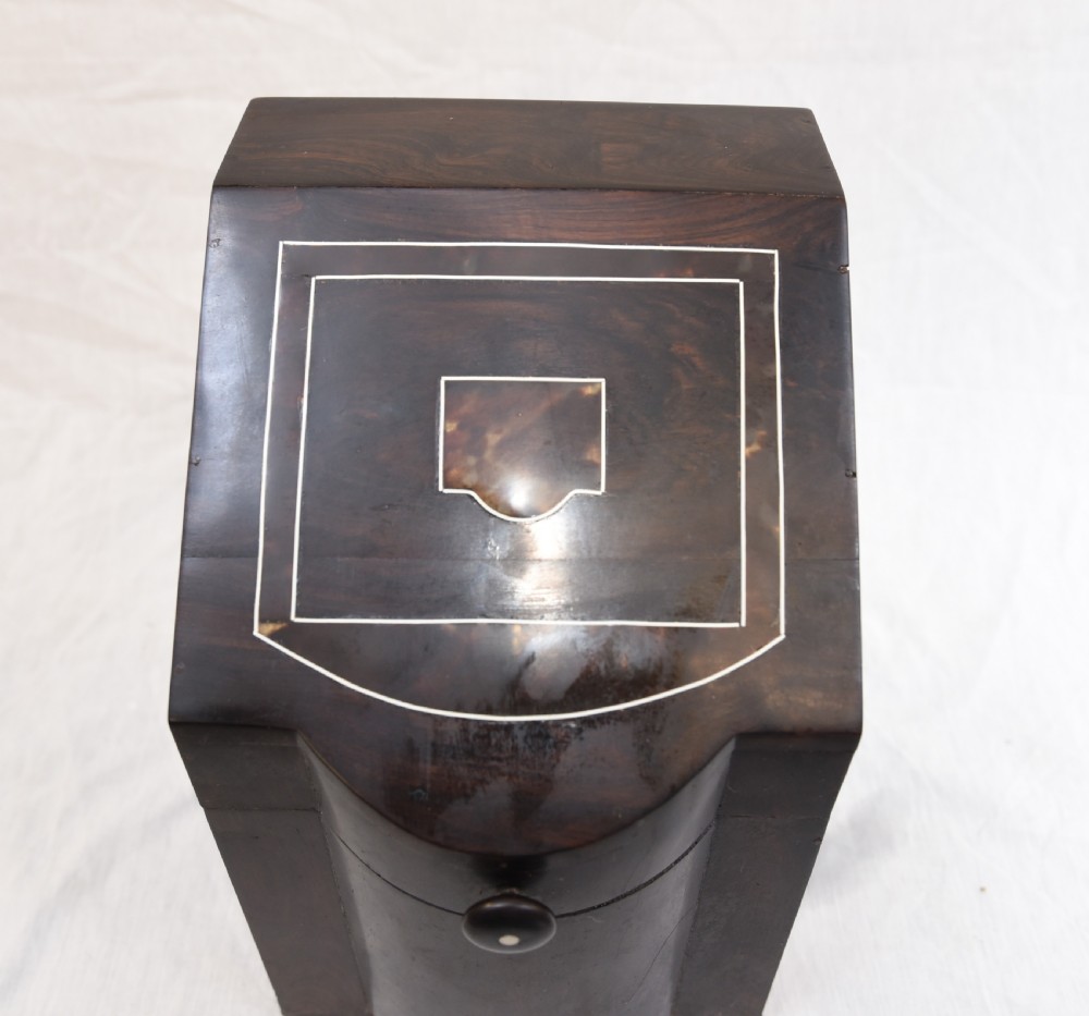 An antique dark brown coromandel wood cutlery box featuring a sloped lid with bone stringing inlay and a circular knob handle. View II
