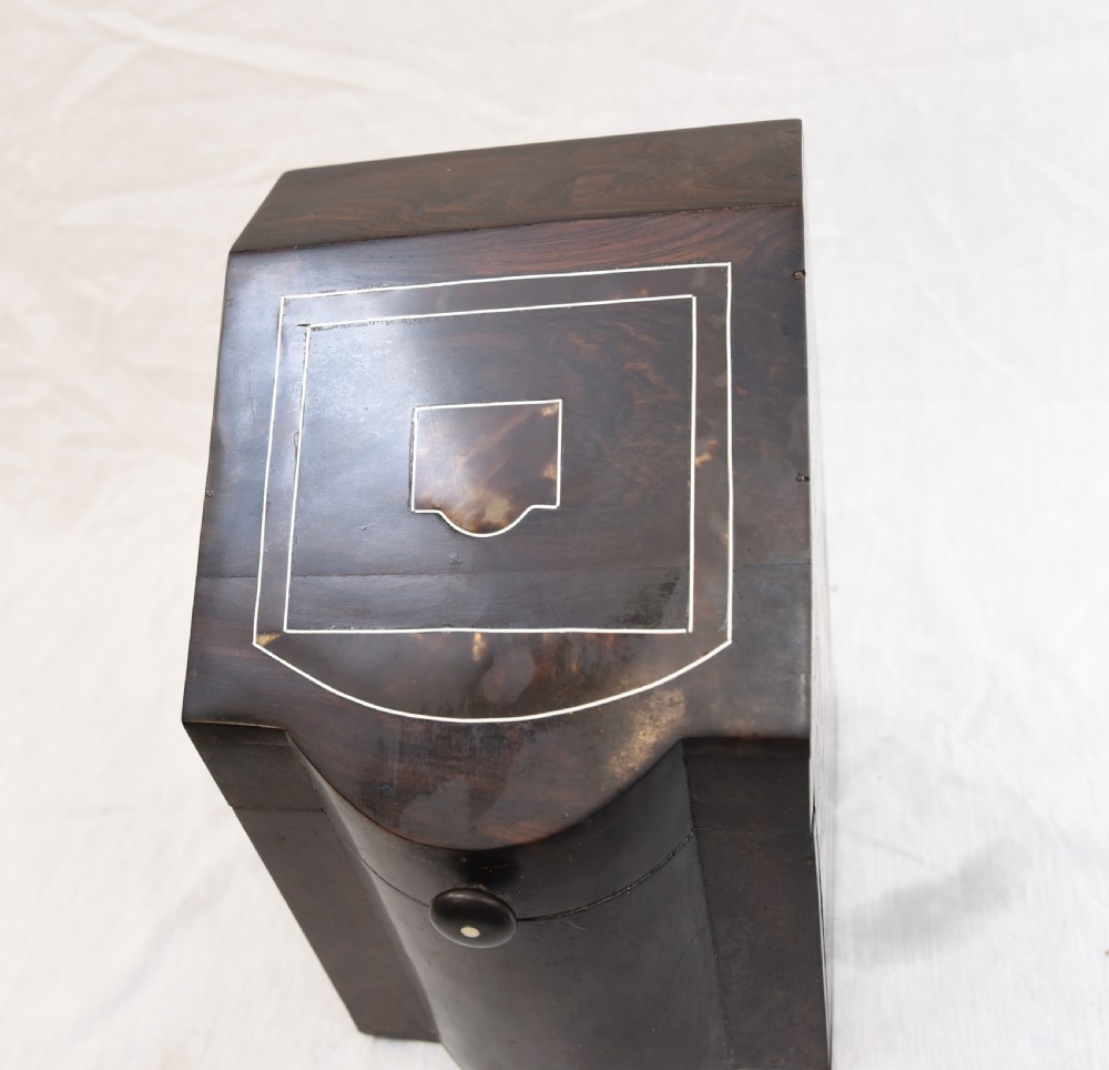 An antique dark brown coromandel wood cutlery box featuring a sloped lid with bone stringing inlay and a circular knob handle. View III