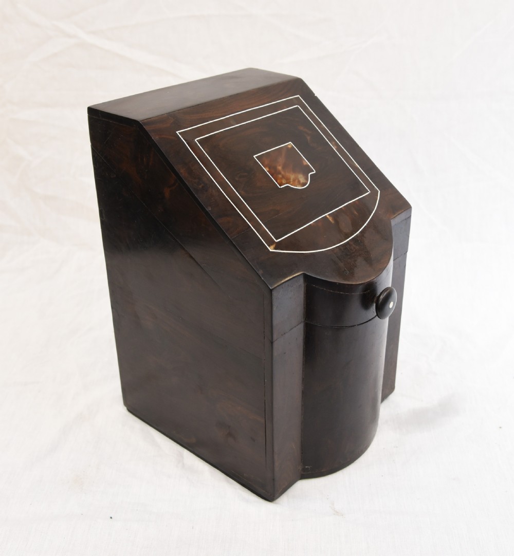 An antique dark brown coromandel wood cutlery box featuring a sloped lid with bone stringing inlay and a circular knob handle. View V