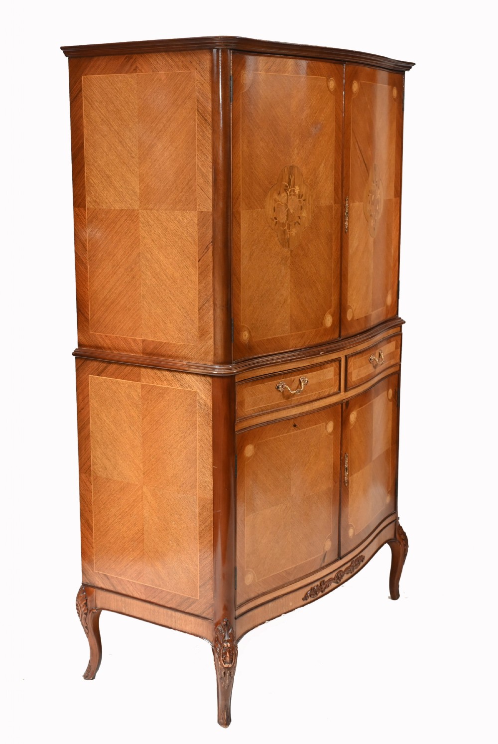 An Art Deco walnut drinks cabinet featuring floral marquetry panel doors, two central drawers, and carved cabriole legs. View IX