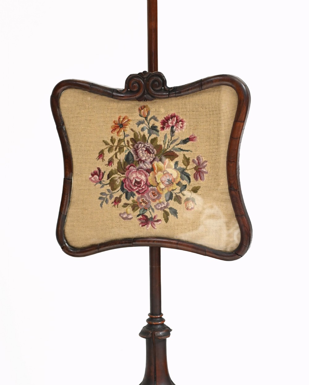 A pair of antique Regency rosewood pole screens with carved triform bases and adjustable framed needlepoint tapestry panels. View VIII
