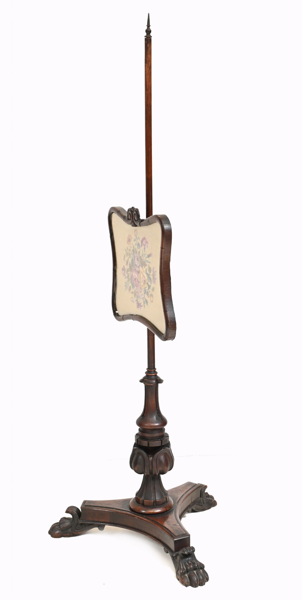 A pair of antique Regency rosewood pole screens with carved triform bases and adjustable framed needlepoint tapestry panels. View XIV