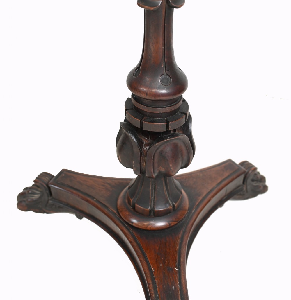 A pair of antique Regency rosewood pole screens with carved triform bases and adjustable framed needlepoint tapestry panels. View XV