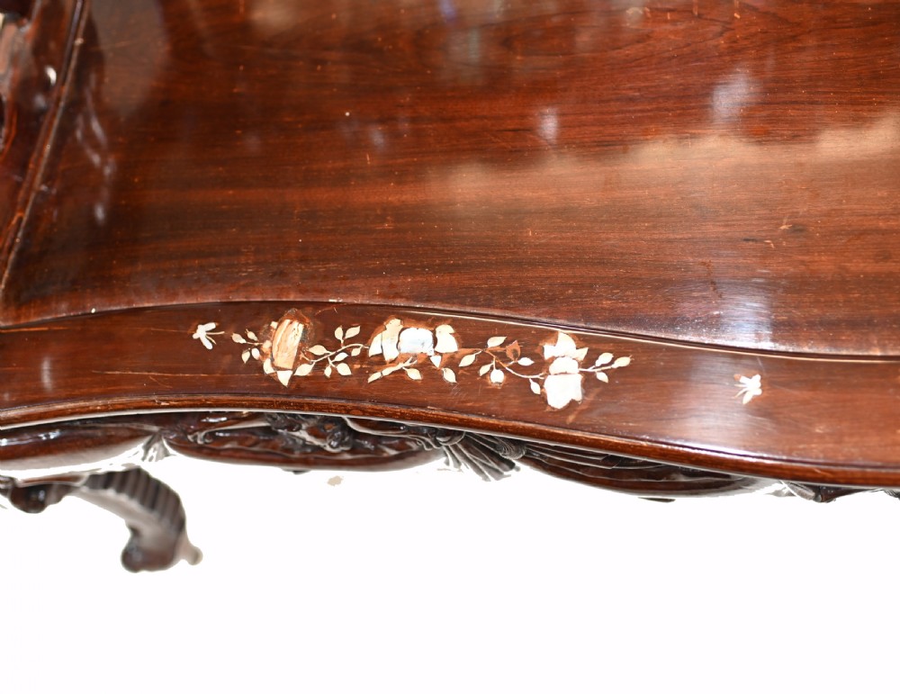 A three-piece dark hardwood seating suite comprising a double bench and two armchairs, decorated with mother of pearl floral inlays and carved detailing. View VI