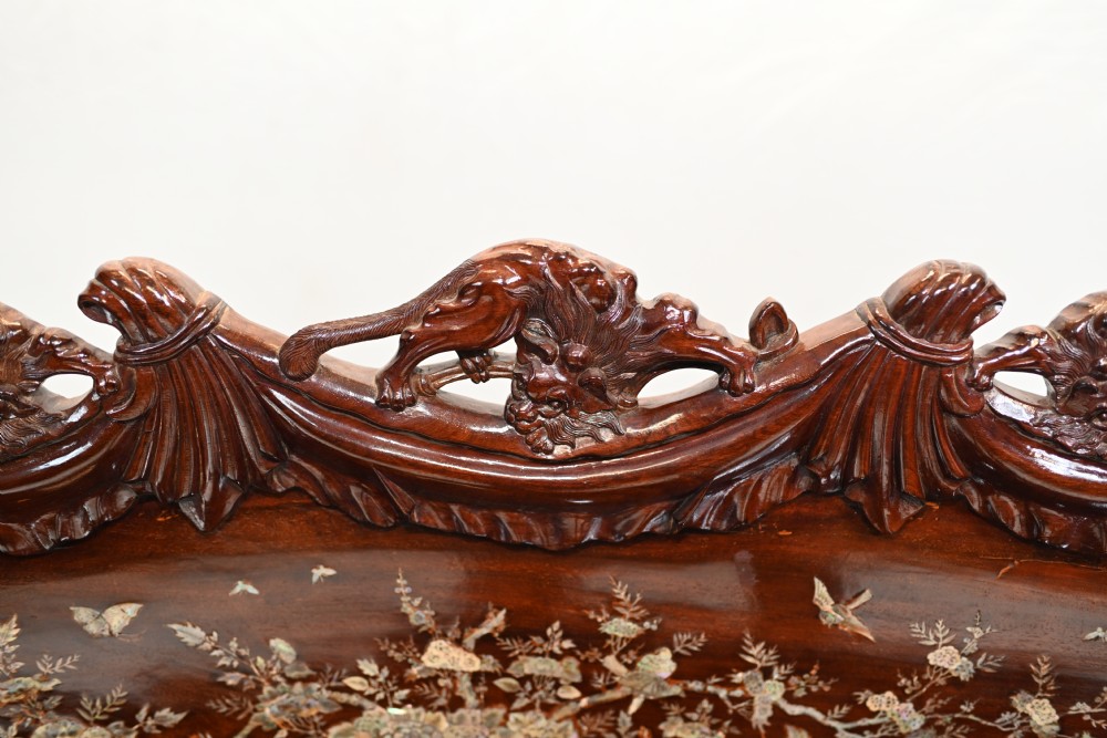 A three-piece dark hardwood seating suite comprising a double bench and two armchairs, decorated with mother of pearl floral inlays and carved detailing. View VII