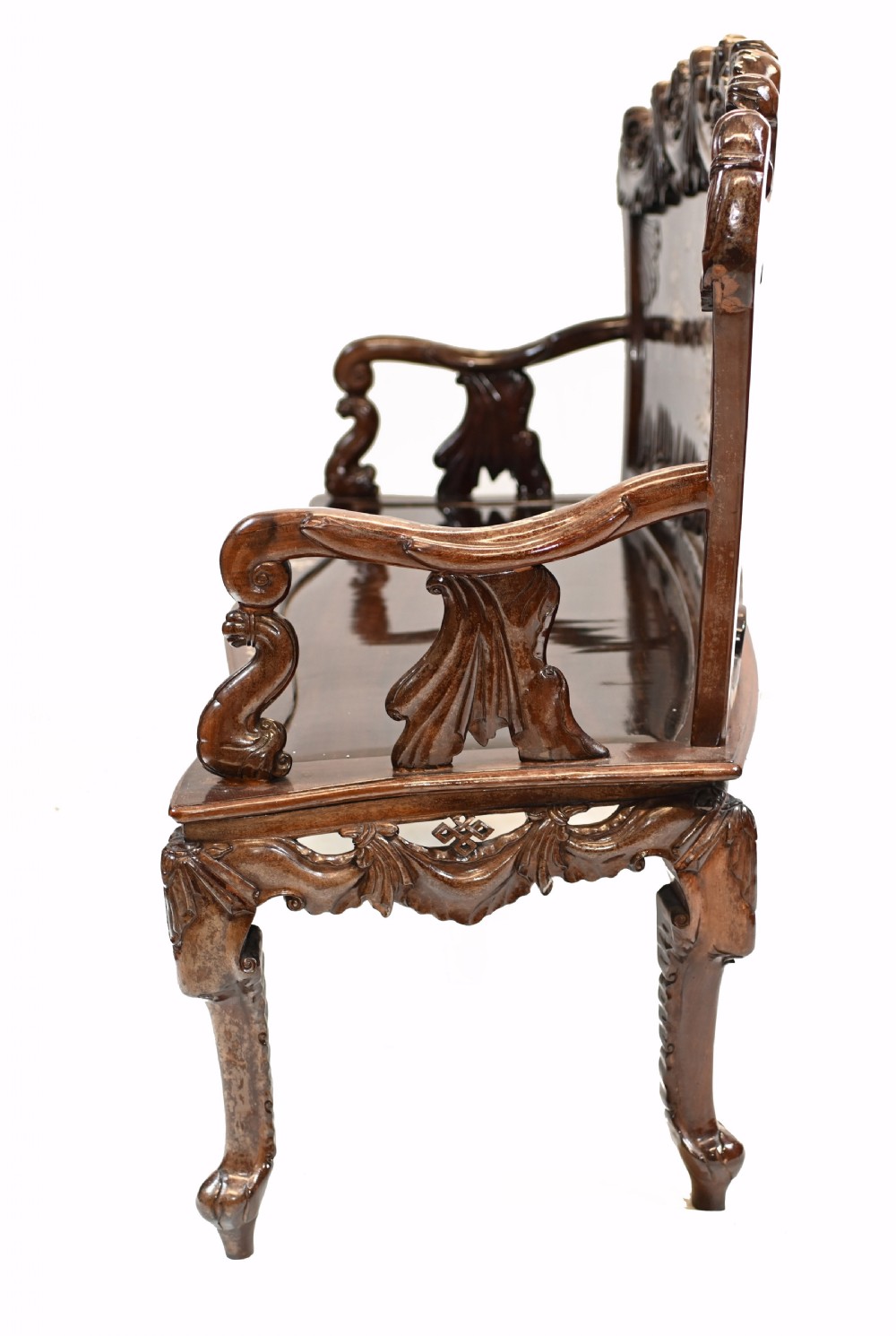 A three-piece dark hardwood seating suite comprising a double bench and two armchairs, decorated with mother of pearl floral inlays and carved detailing. View IX