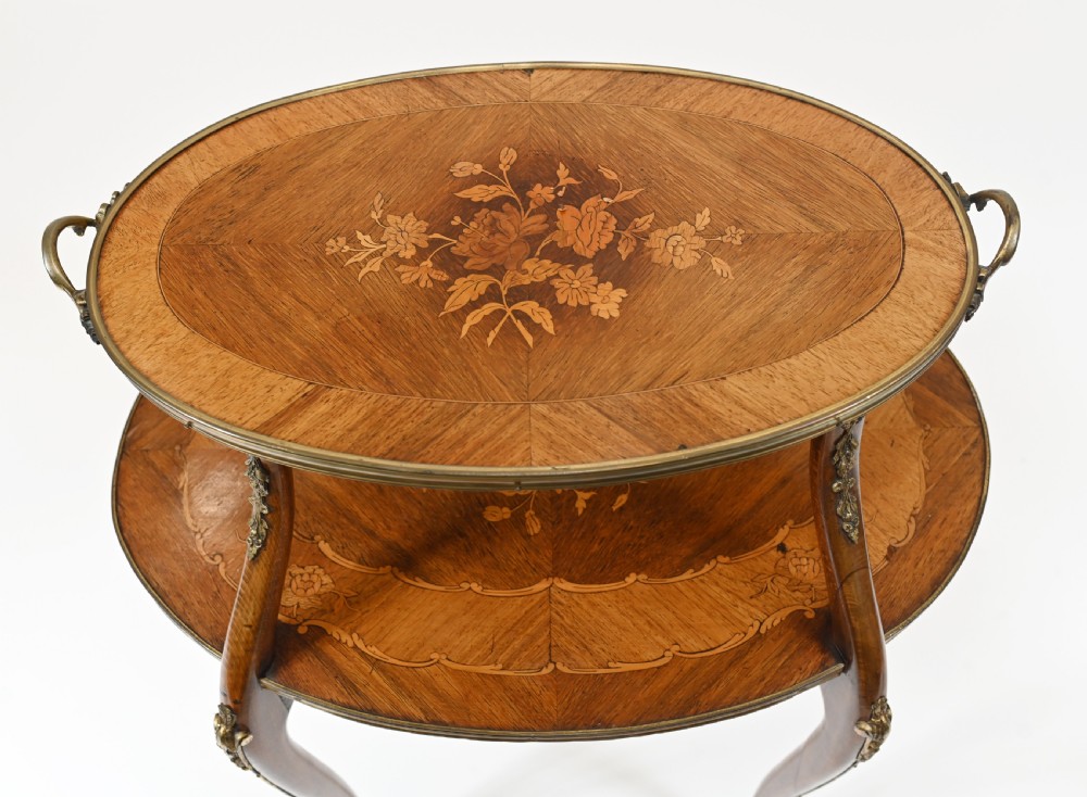 An antique French two-tiered oval etagere side table featuring floral marquetry inlay, slender cabriole legs, and polished brass mounts. View III
