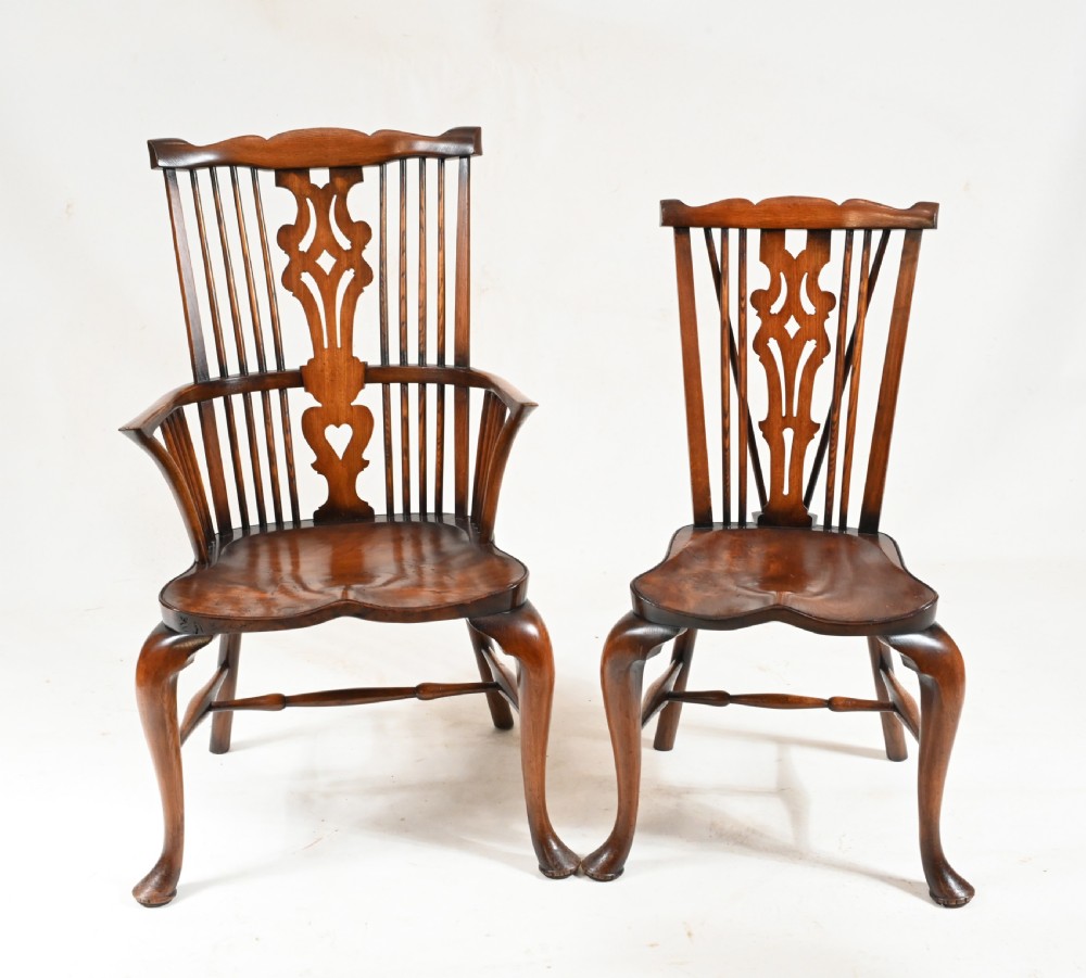 A set of eight yew wood Windsor dining chairs featuring pierced splats, saddle seats, and cabriole front legs. View IV