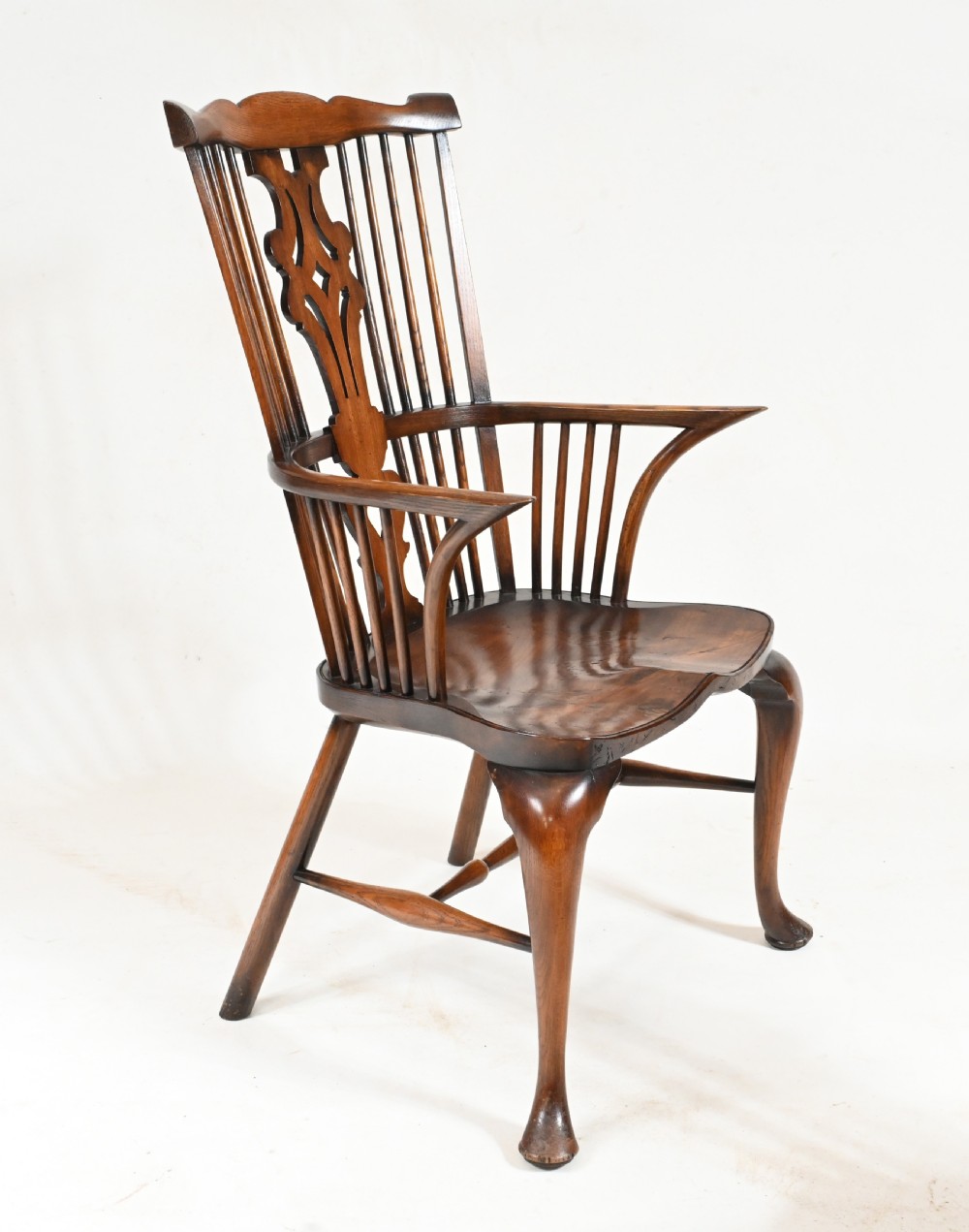 A set of eight yew wood Windsor dining chairs featuring pierced splats, saddle seats, and cabriole front legs. View VII