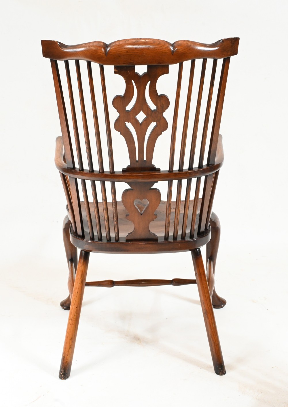 A set of eight yew wood Windsor dining chairs featuring pierced splats, saddle seats, and cabriole front legs. View VIII