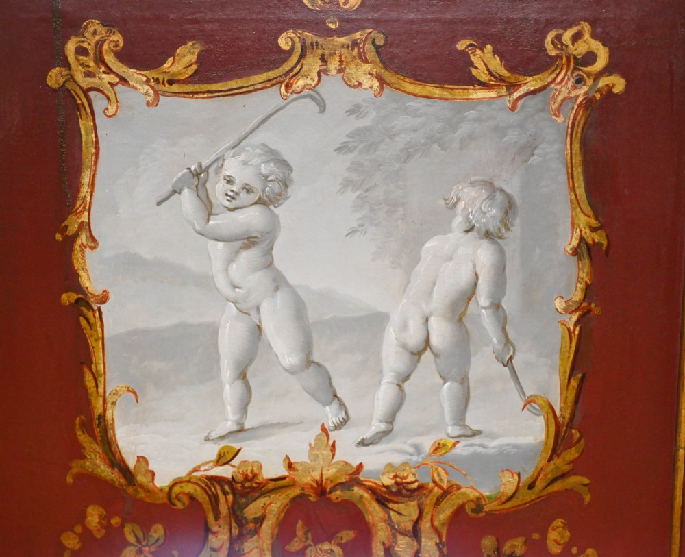 A red six-panel folding screen painted with classical figures, cherubs, and urns within gilded scrollwork borders. View III