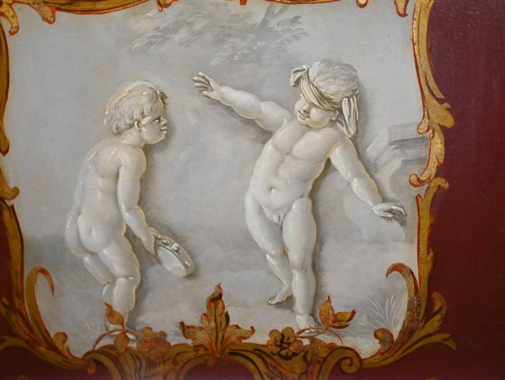 A red six-panel folding screen painted with classical figures, cherubs, and urns within gilded scrollwork borders. View XI