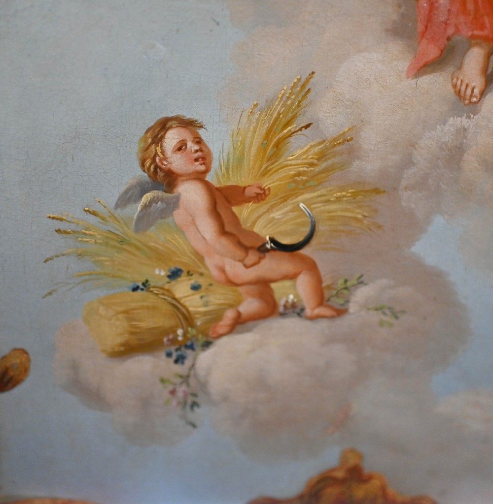 A red six-panel folding screen painted with classical figures, cherubs, and urns within gilded scrollwork borders. View XII