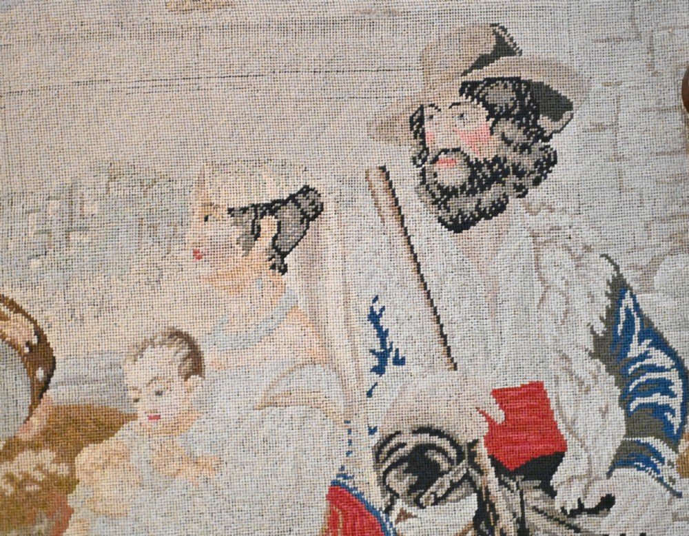 An early Victorian carved wooden fire screen featuring a hand-worked needlepoint tapestry of a pastoral scene set within a scrolled frame. View VII