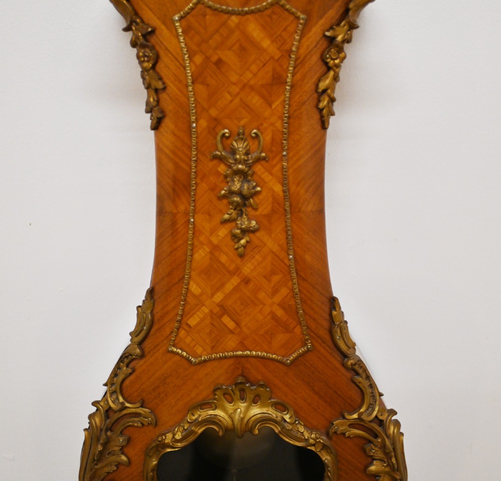 A French longcase clock featuring a waisted kingwood veneer body with gilt-bronze mounts and an enamelled dial. View II