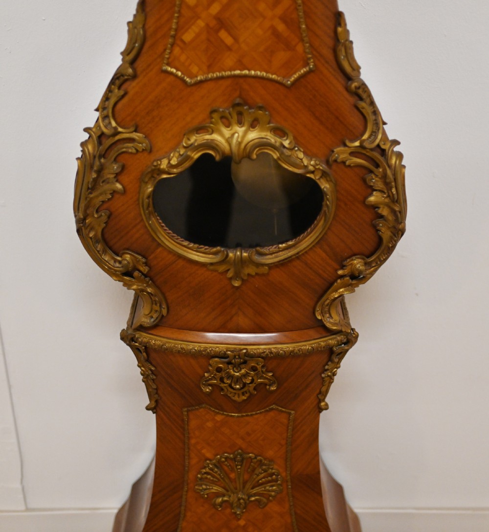 A French longcase clock featuring a waisted kingwood veneer body with gilt-bronze mounts and an enamelled dial. View III