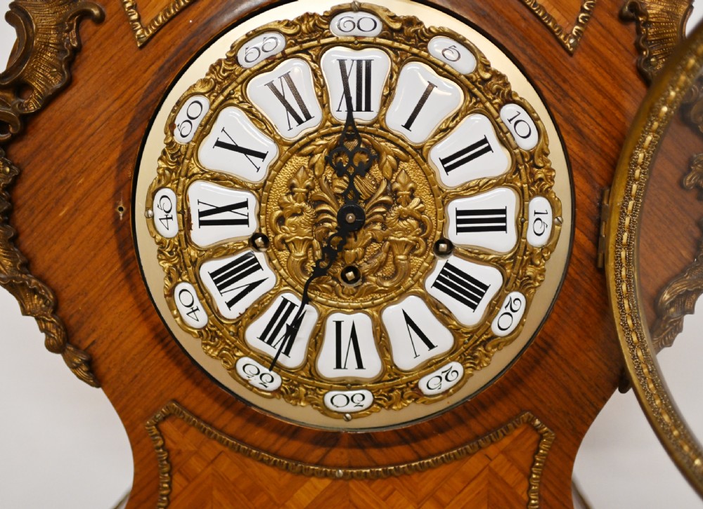 A French longcase clock featuring a waisted kingwood veneer body with gilt-bronze mounts and an enamelled dial. View VI