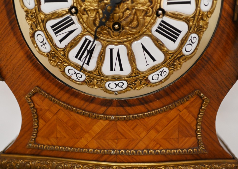 A French longcase clock featuring a waisted kingwood veneer body with gilt-bronze mounts and an enamelled dial. View VII