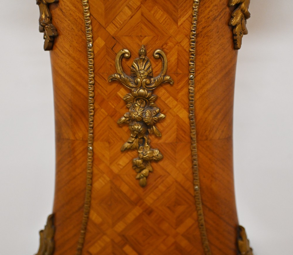 A French longcase clock featuring a waisted kingwood veneer body with gilt-bronze mounts and an enamelled dial. View VIII