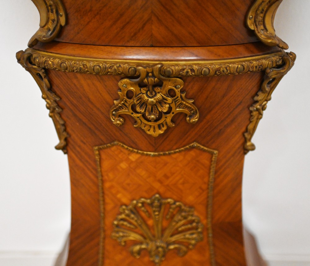A French longcase clock featuring a waisted kingwood veneer body with gilt-bronze mounts and an enamelled dial. View XI