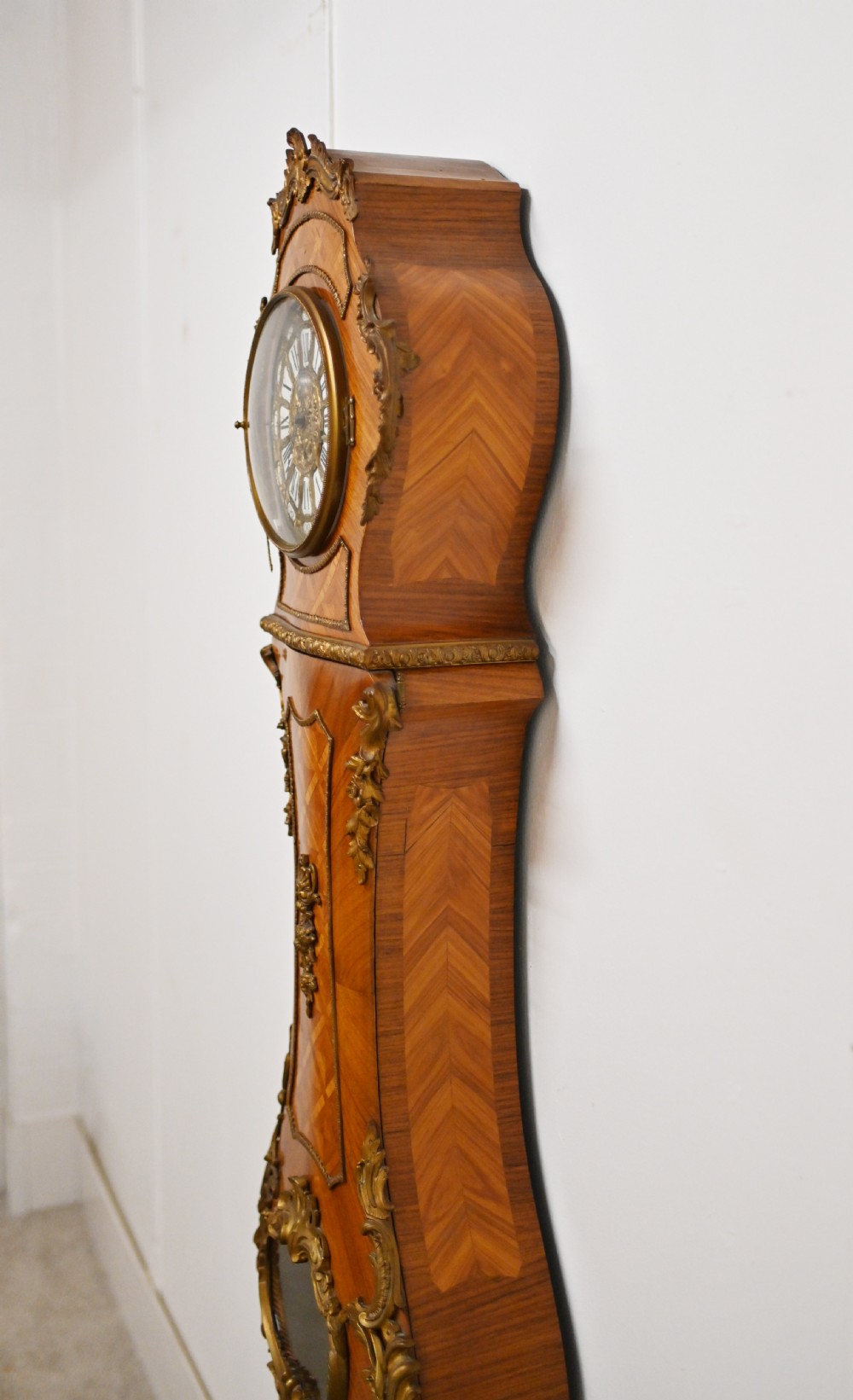 A French longcase clock featuring a waisted kingwood veneer body with gilt-bronze mounts and an enamelled dial. View XIII