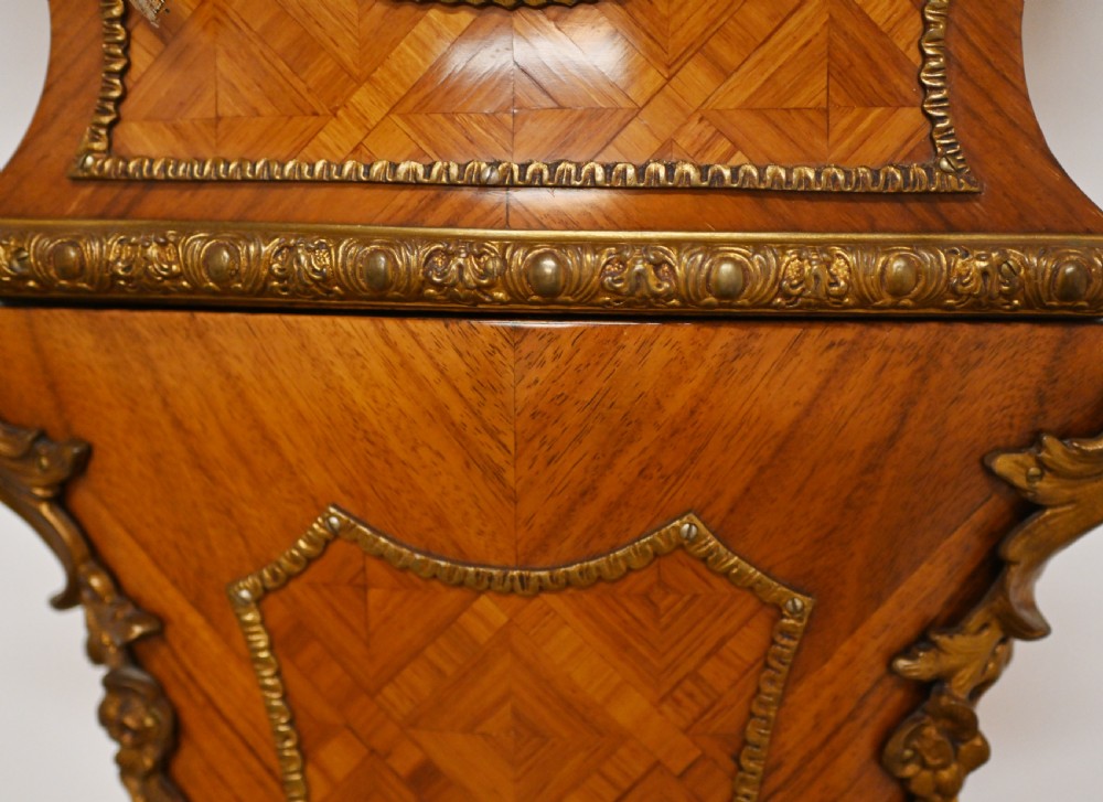 A French longcase clock featuring a waisted kingwood veneer body with gilt-bronze mounts and an enamelled dial. View XV