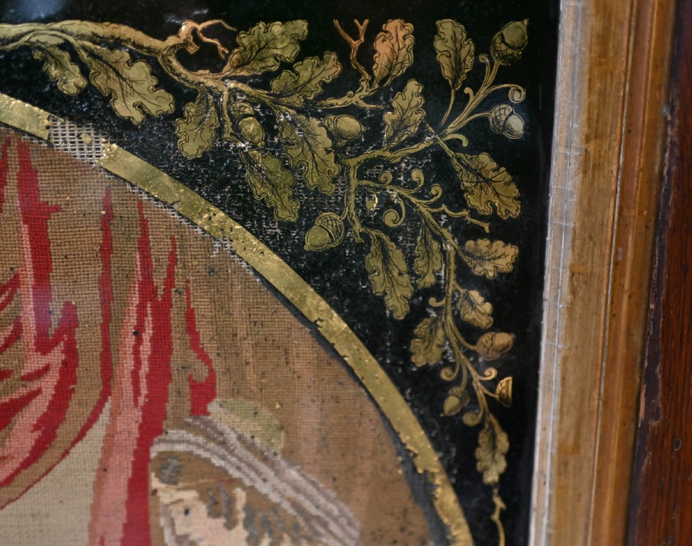 A framed 1865 needlepoint picture depicting a group of courtly maidens in historical dresses, enclosed in an arched gilt black glass mat and polished walnut frame. View IV