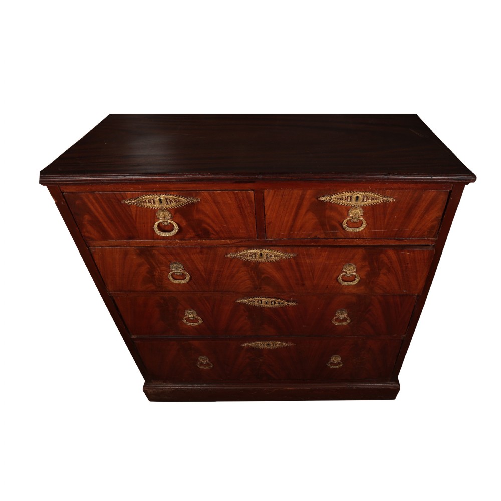 A 19th-century Biedermeier flame mahogany chest of drawers featuring decorative brass escutcheons and drop ring handles. View V