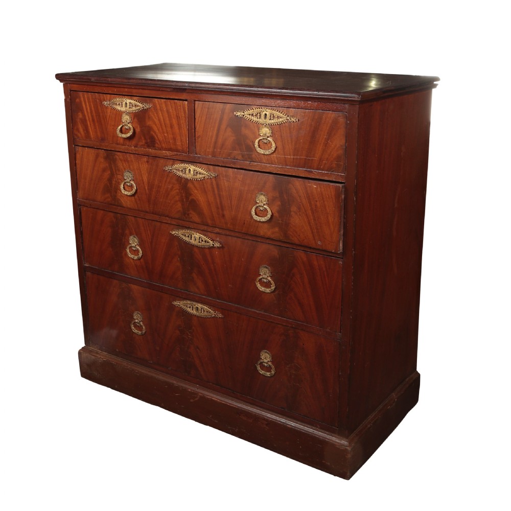 A 19th-century Biedermeier flame mahogany chest of drawers featuring decorative brass escutcheons and drop ring handles. View VI