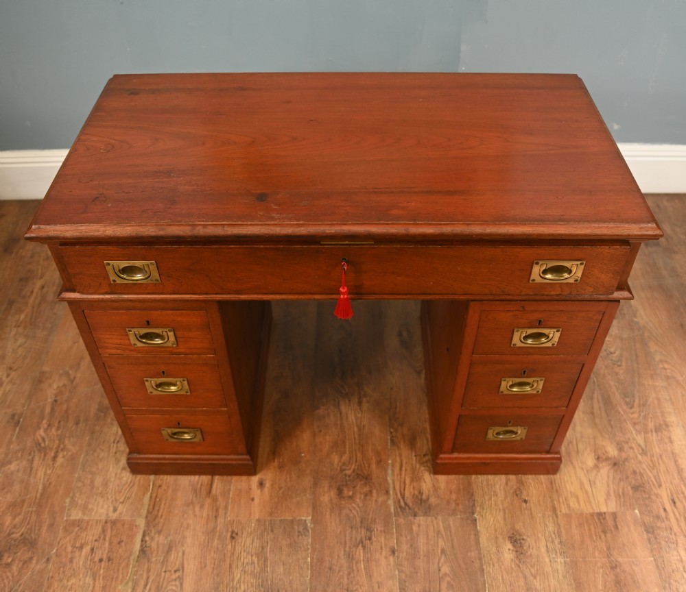 A Victorian mahogany campaign pedestal desk featuring flush brass handles, multiple drawers, and a polished timber surface. View III