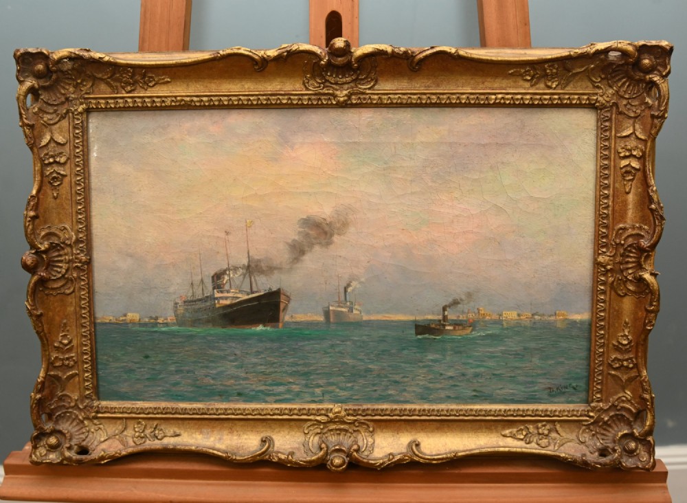 A Victorian oil painting depicting steamships near a shoreline, set in an ornate gilded frame.