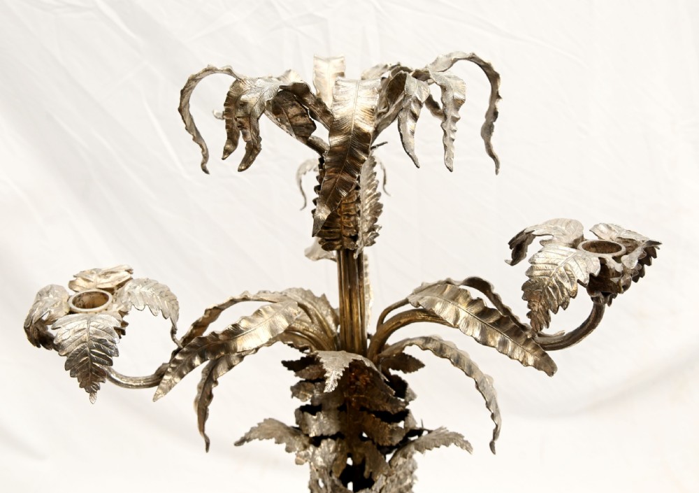 A silver-plated three-light candelabra designed in the shape of a palm tree with detailed foliate leaves and a scrolled base. View VI