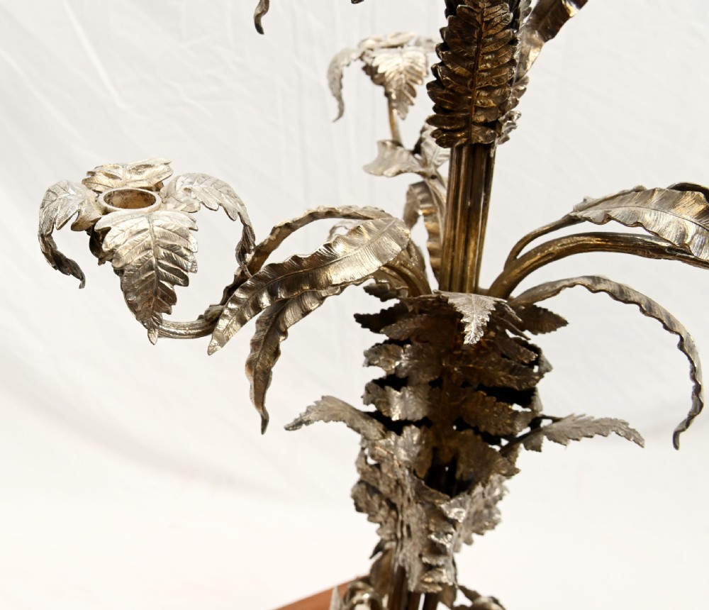 A silver-plated three-light candelabra designed in the shape of a palm tree with detailed foliate leaves and a scrolled base. View VII