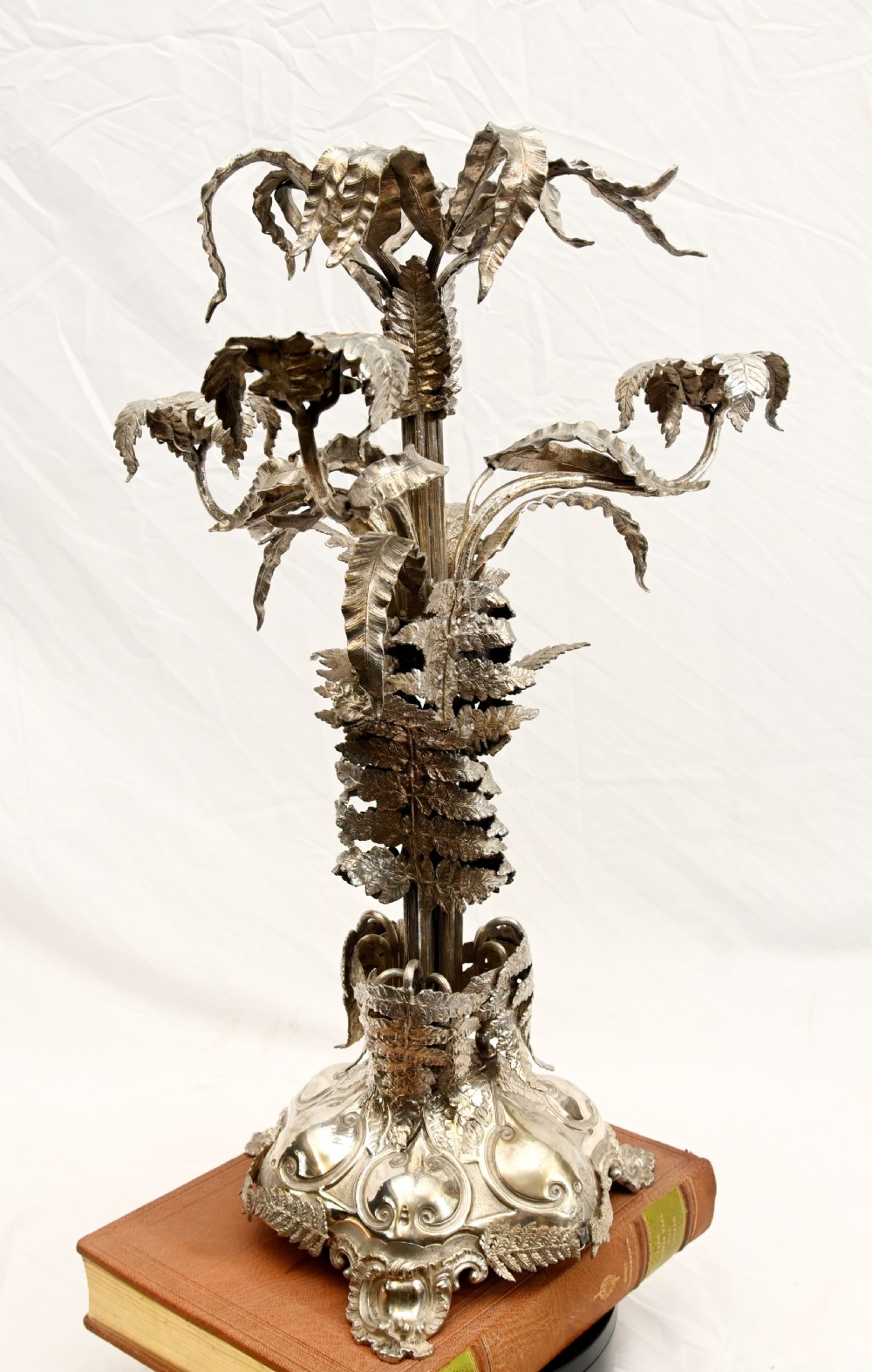 A silver-plated three-light candelabra designed in the shape of a palm tree with detailed foliate leaves and a scrolled base. View VIII
