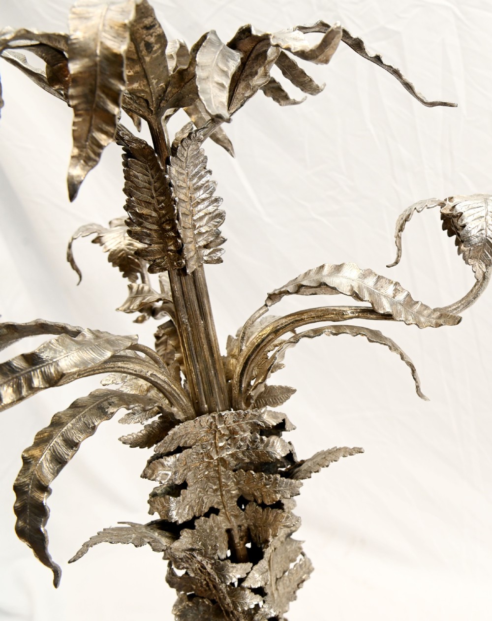 A silver-plated three-light candelabra designed in the shape of a palm tree with detailed foliate leaves and a scrolled base. View XIV