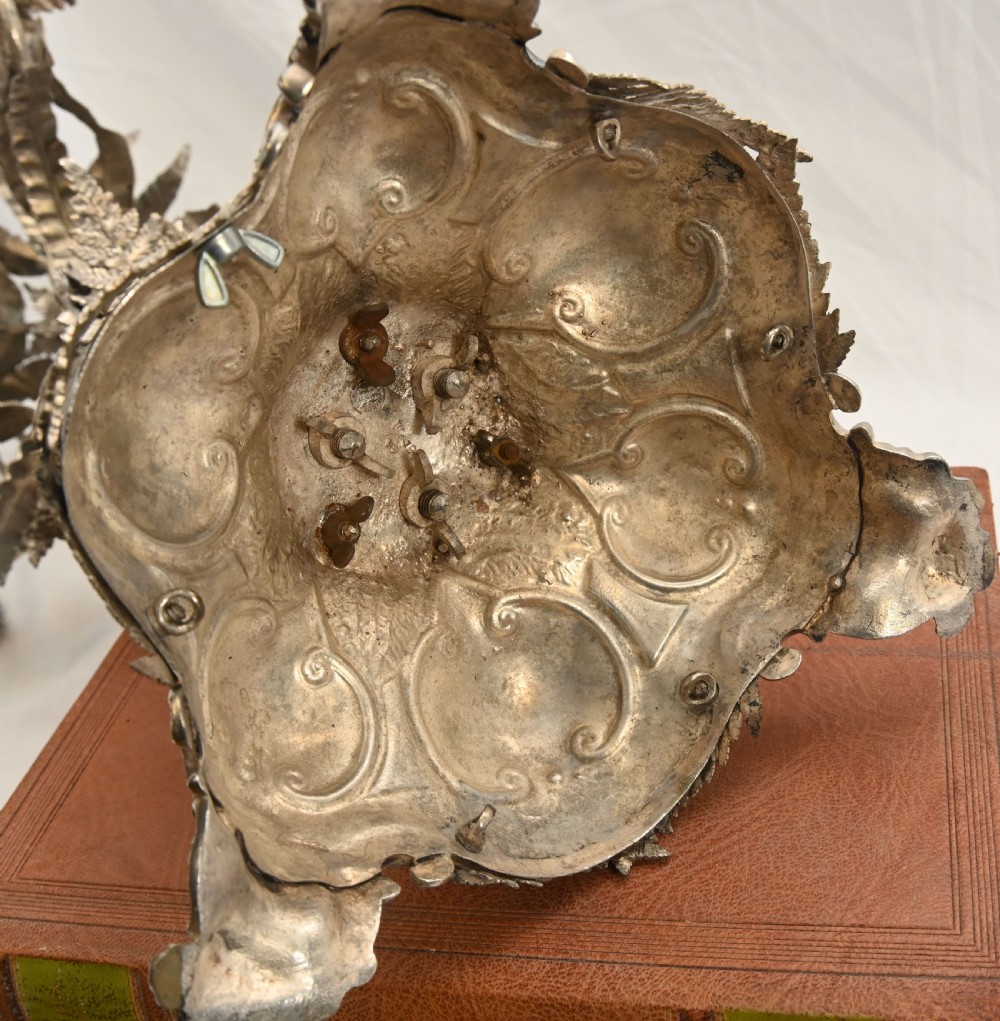A silver-plated three-light candelabra designed in the shape of a palm tree with detailed foliate leaves and a scrolled base. View XVI